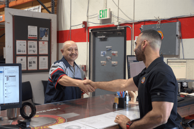 Shaking Hands at Counter